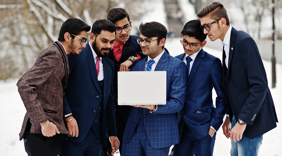 group-six-indian-businessman-suits-posed-outdoor-winter-day-europe-looking-laptop (1) 2